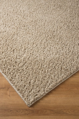 Ashley Signature Design Caci 5' x 7' Rug Beige R240002