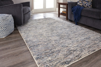 Ashley Signature Design Marnin 7'10" x 10' Rug Tan/Blue/Cream R404121